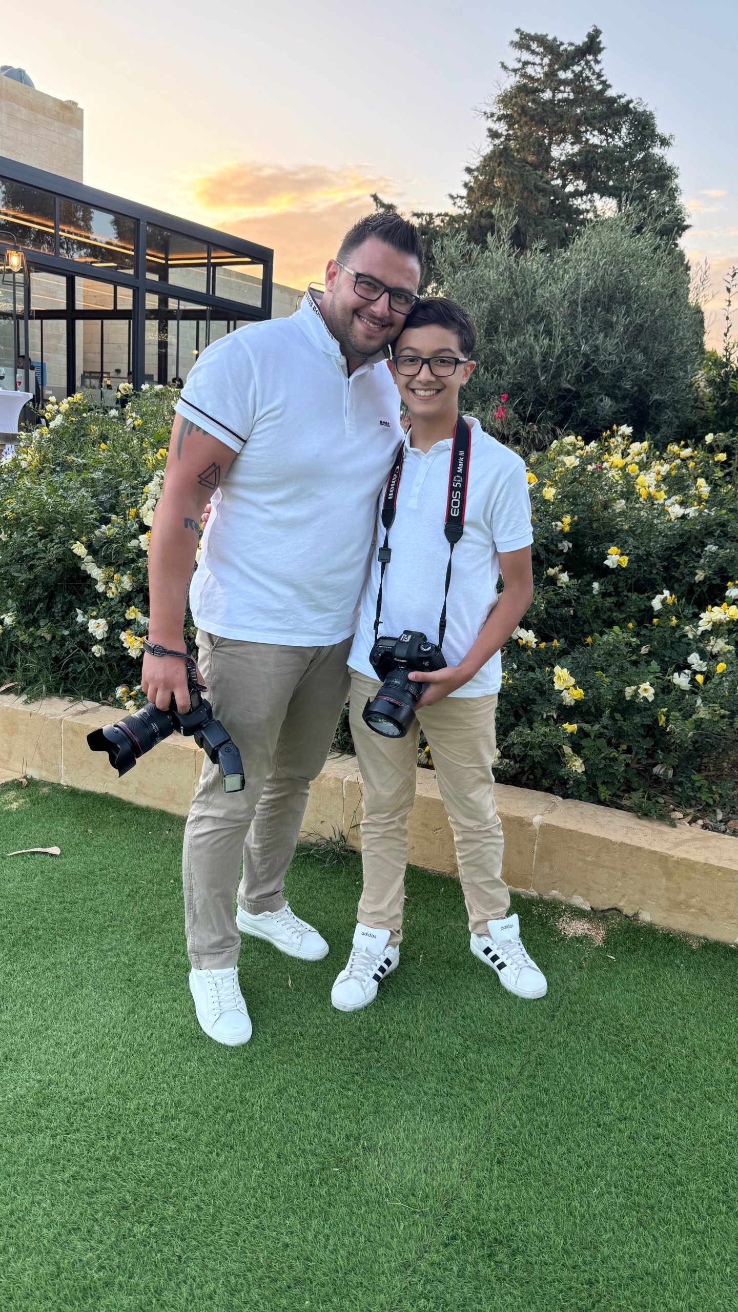 Parent showing child how to use a camera